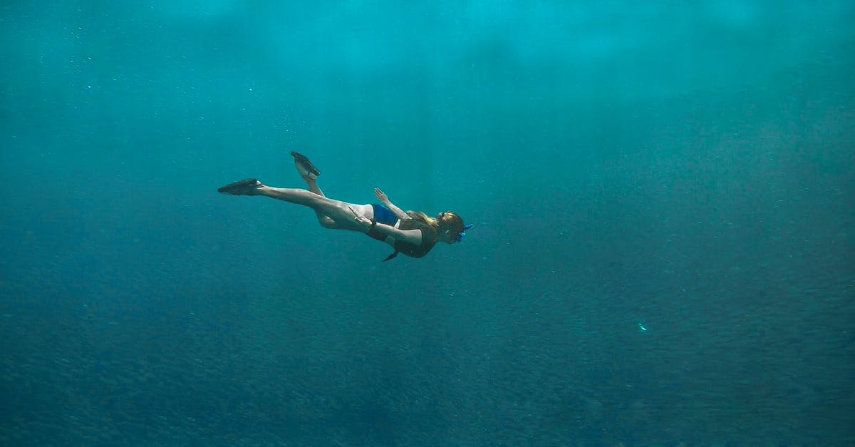 11 years Overstayed in the Philippines - Photo of Woman Swimming Underwater