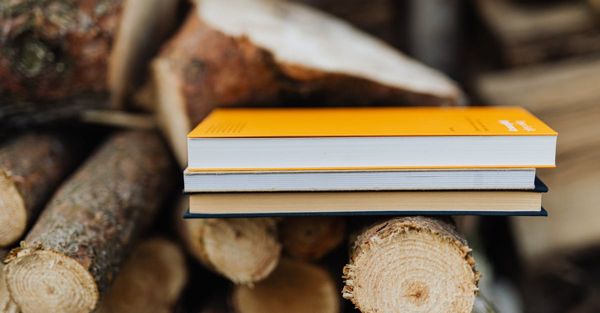 12-hour Daytime Luggage Storage in San Juan, Puerto Rico? - Books placed on edge of freshly prepared woodpile in backyard of countryside house