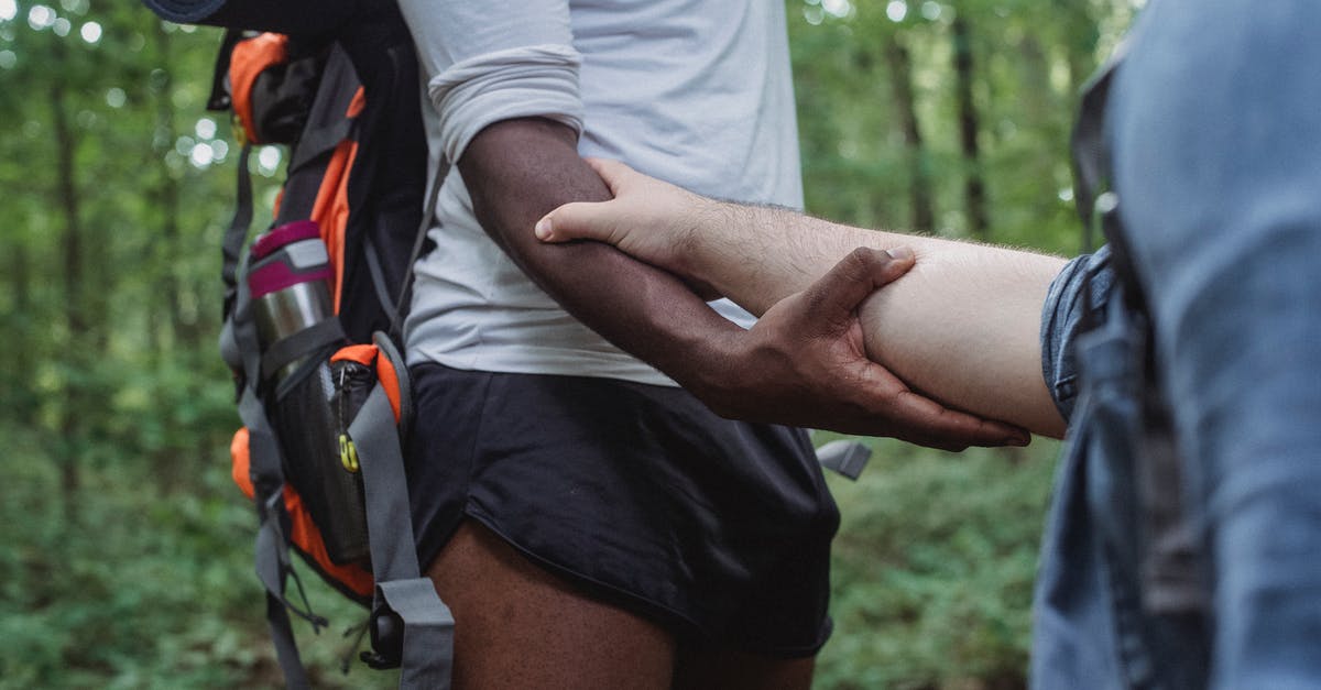 15 days vacations nature oriented in Quebec [closed] - Faceless traveler holding hand of black man