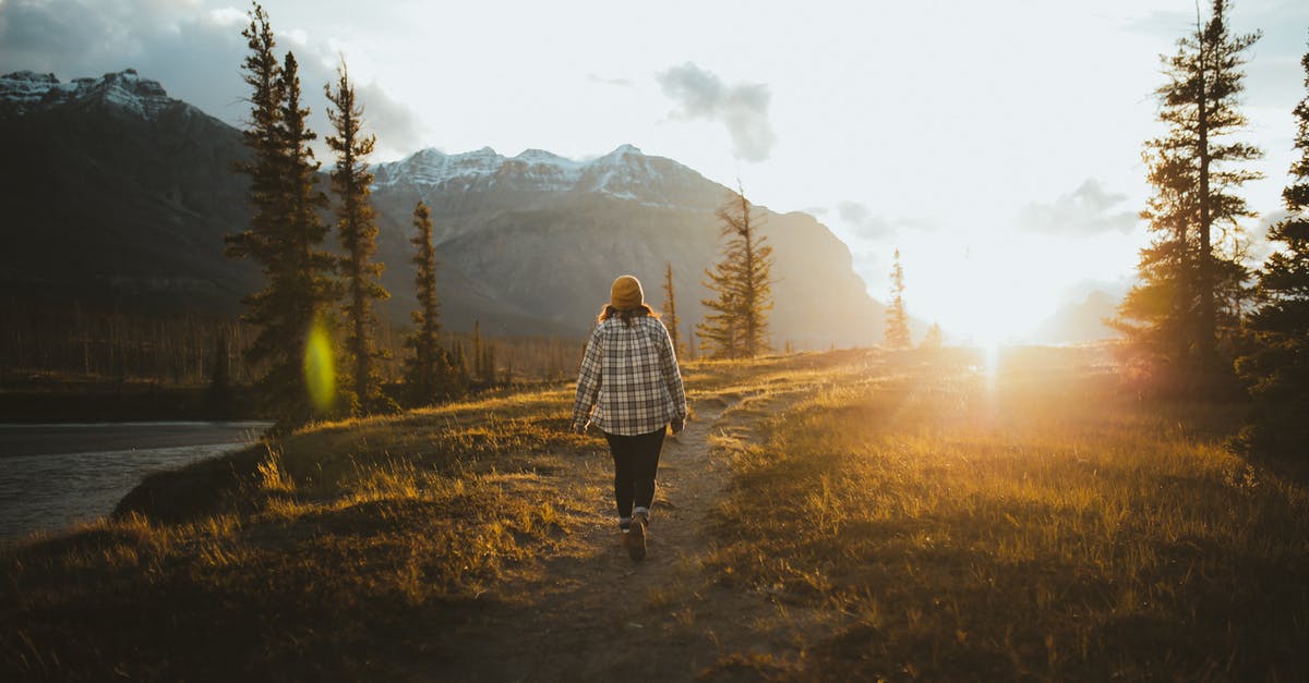 17 to canada and back [duplicate] - A Person Walking During Sunset