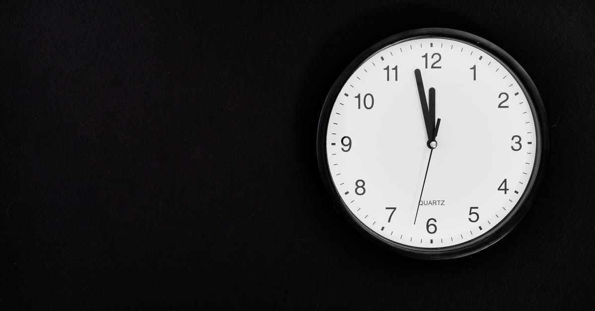 1 Hour 10 Minute Connection in New Istanbul Airport - Black Round Analog Wall Clock On Black Background