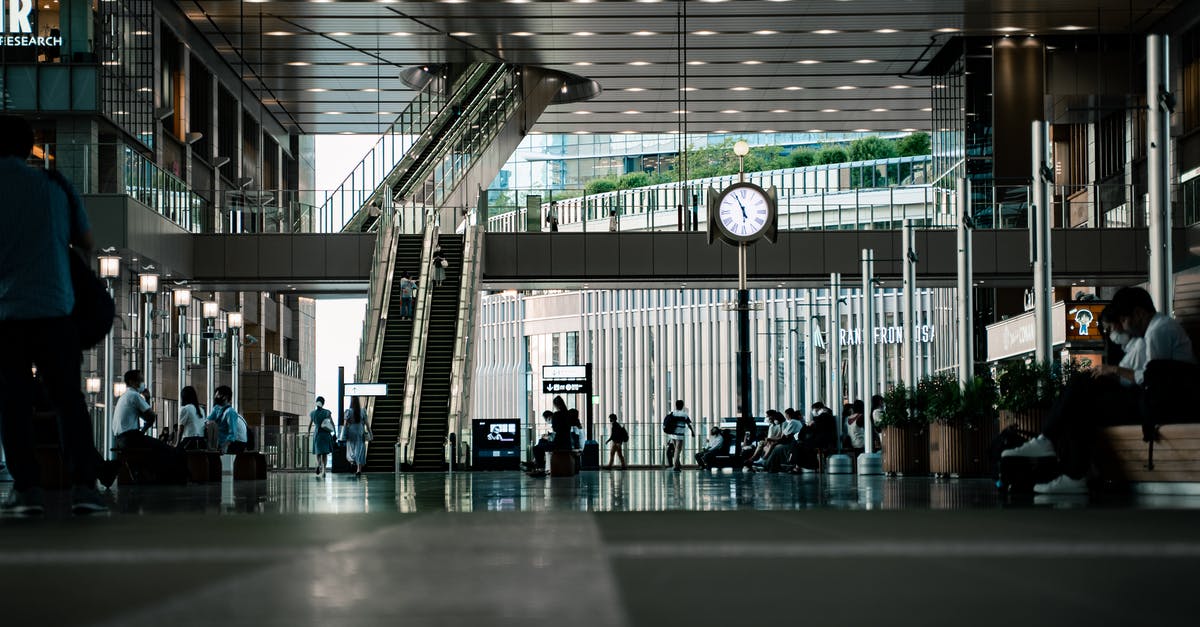 20-hr layover in Japan - People Sitting on Bench Inside Building