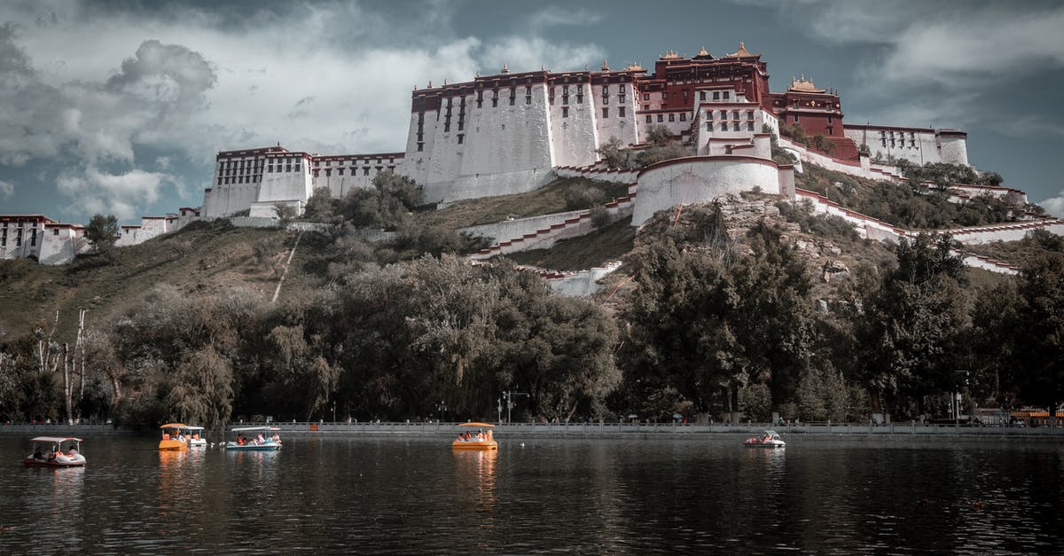 24 Hour TWOV in China - White and Brown Concrete Building Near Body of Water