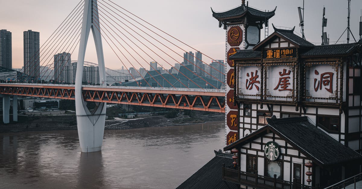 24 Hour TWOV in China - Red and White Bridge over the River