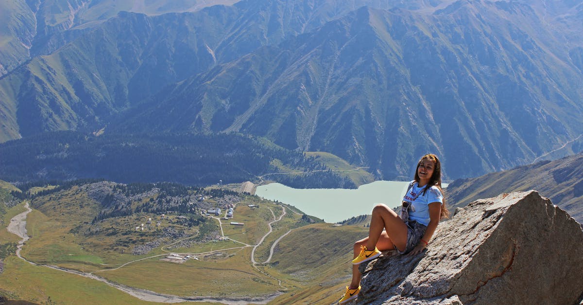 26 hour layover in Almaty, Kazakhstan - Woman Sitting on Gray Stone