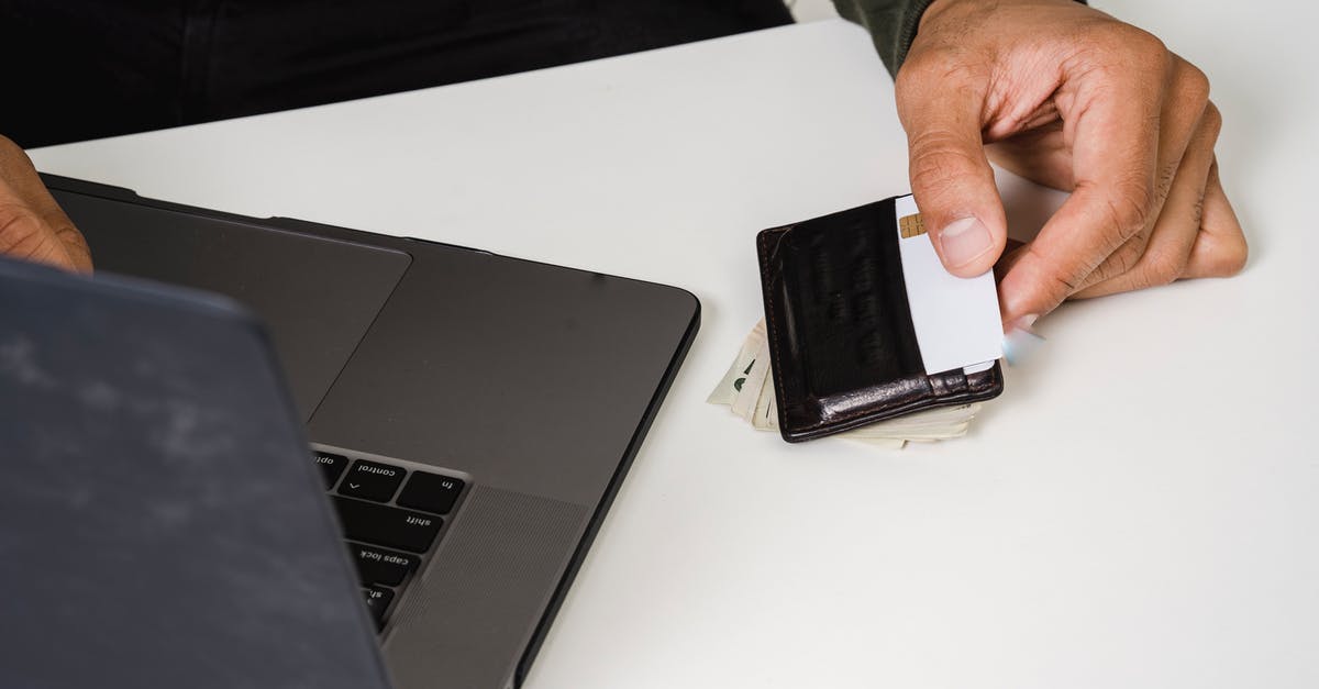 2 CharlieCards, 1 Wallet? - Photo Of Person Holding White Card 