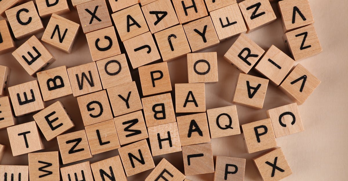 3 blocks away from a fraud? [closed] - Close-Up Photo of Wooden Blocks with Letters