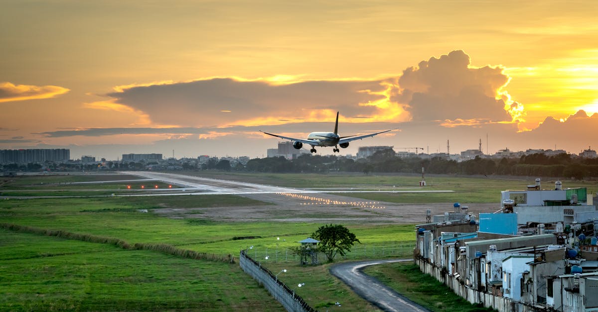 3 hours layover at Haneda airport to US [duplicate] - An Airplane About to Take off Under Evening Sky