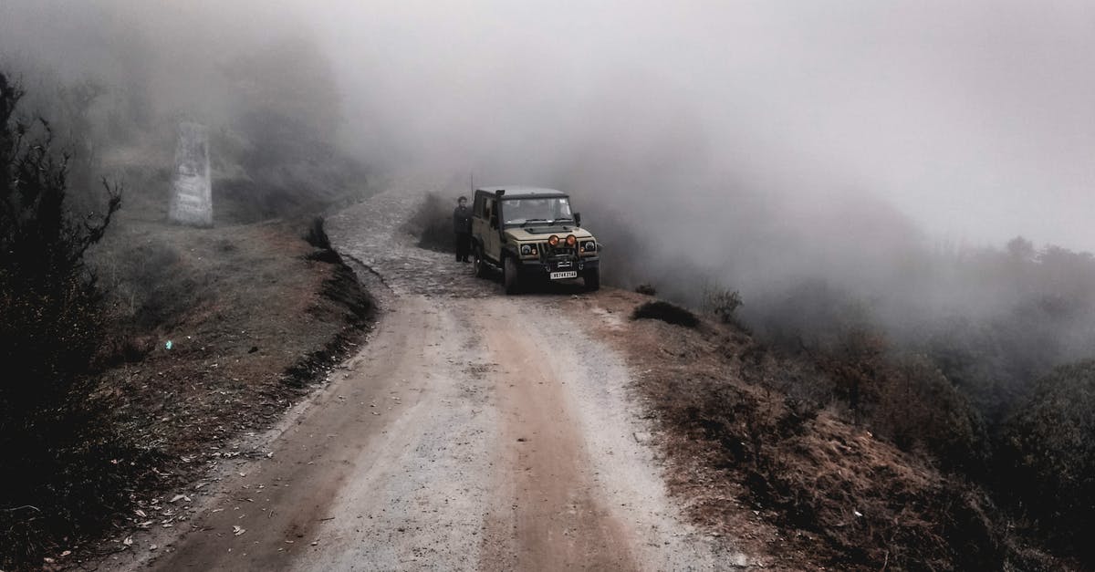 4x4 Rental in Northern Idaho - Black Suv on Road Covered With Fog