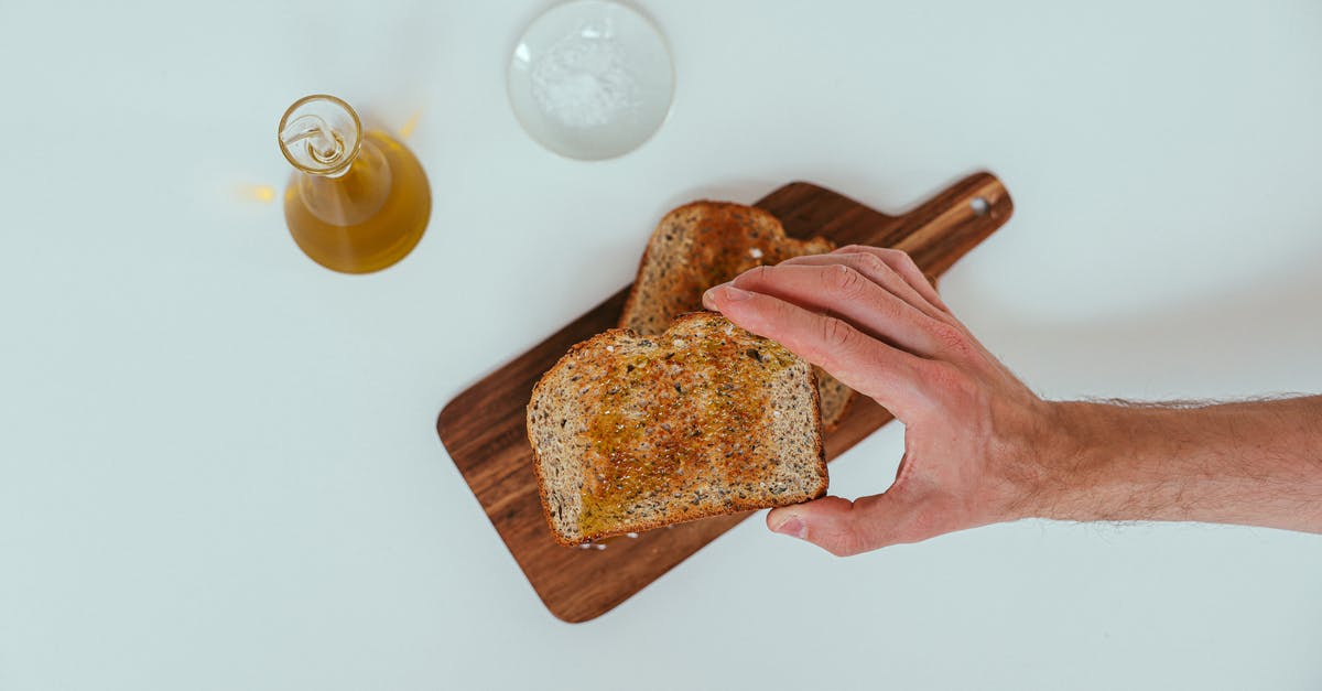 5 kg hard honey in hand luggage? - A Person Grabbing a Toasted Bread