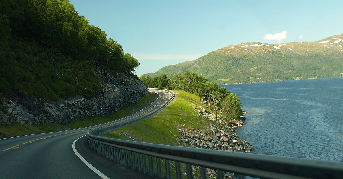 A complete set of driving rules in Norway - Concrete Road Near Body Of Water