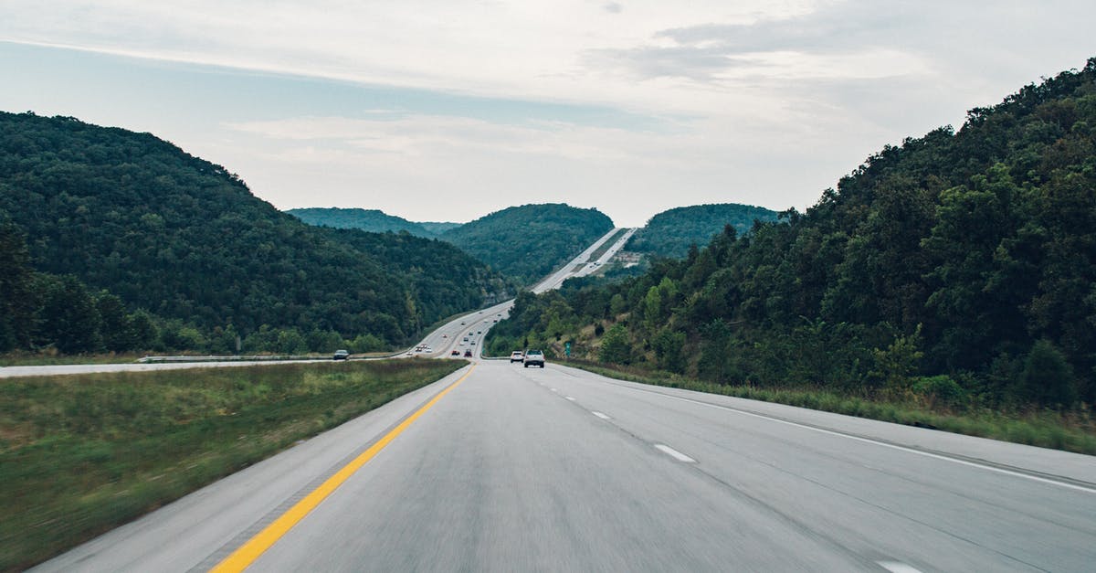 A question about traveling between Schengen countries - Road Between Green Leafed Trees