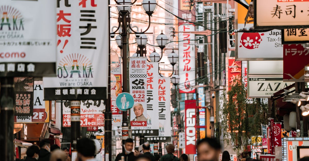 A question about work life in Japan [closed] - People Walking on Street in Osaka Japan