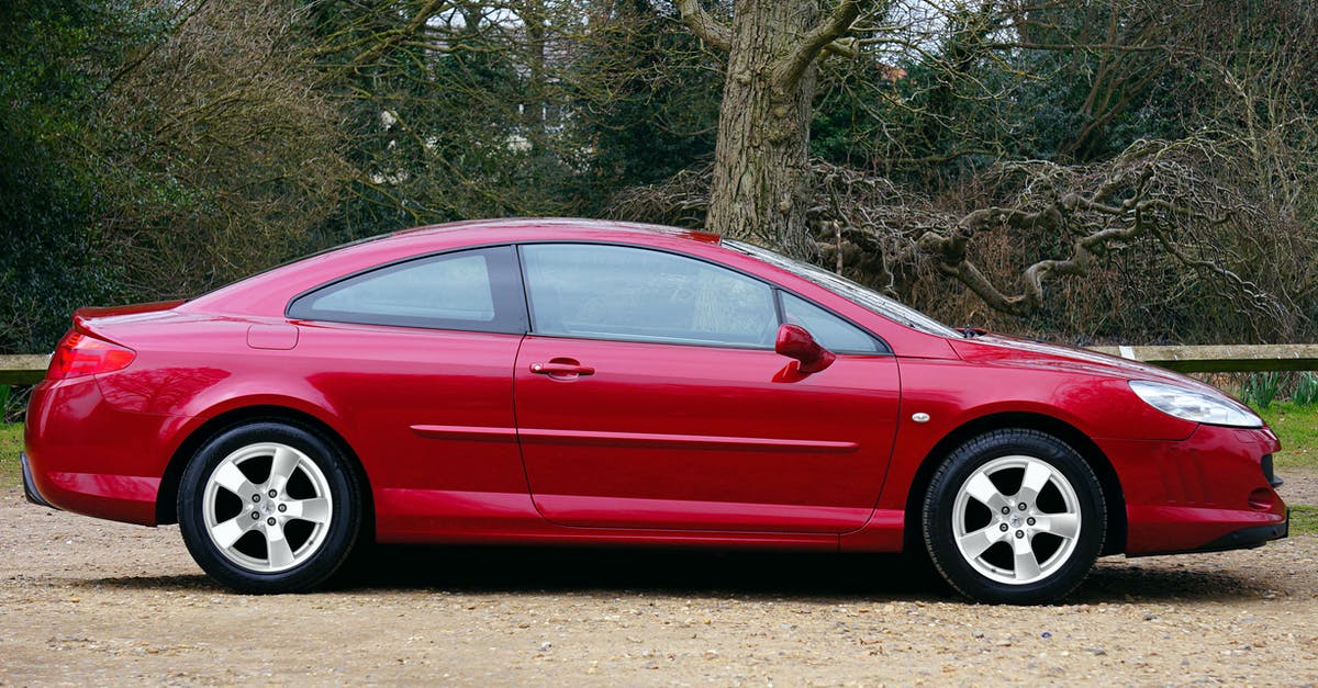 AAA benefits as member of a European automobile club? (IHG rates) - Red Coupe Parked Near Tree