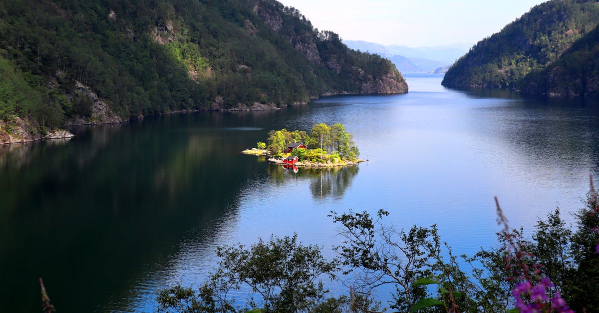 About Jeju Island visas - Yellow Kayak on Lake Near Green Mountains