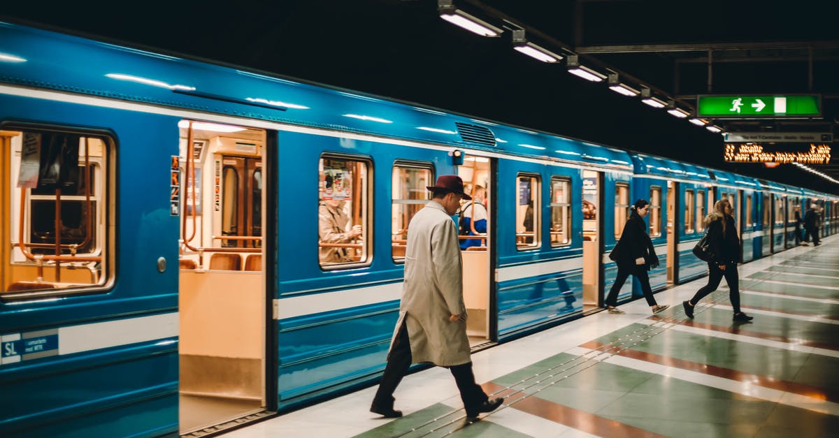 About my Transit Visa, DATV - Metro station with passengers on platform