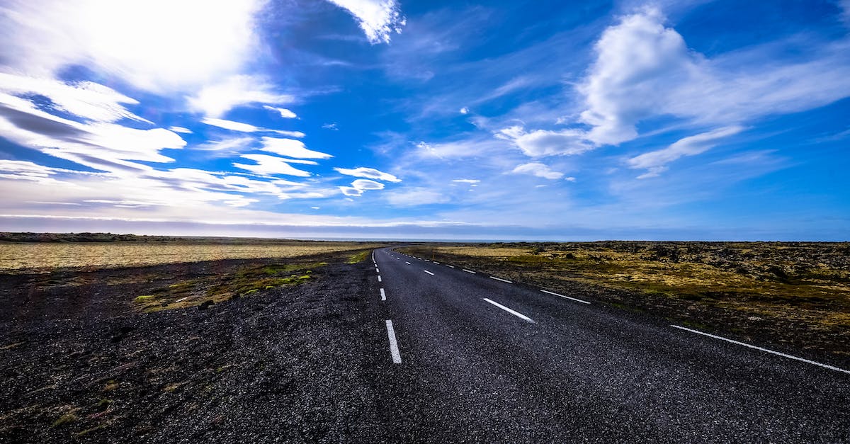 Absolute cheapest means of travelling long distance and duration [closed] - Black Asphalt Road Surrounded by Green Grass