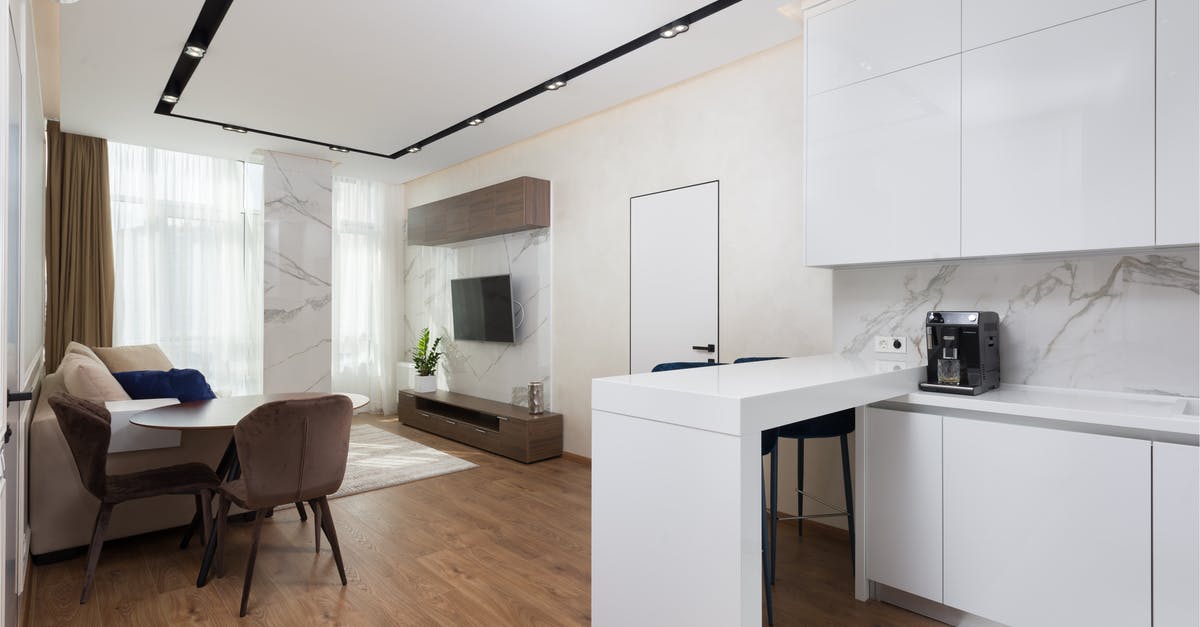 Accommodation cost in UK visa application - Minimalist interior of modern apartment with kitchen and living room