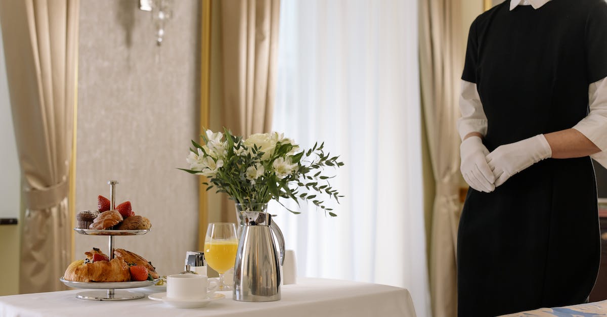 Accommodation, sights and food in Maui - Woman Standing Near the Table with Pastries