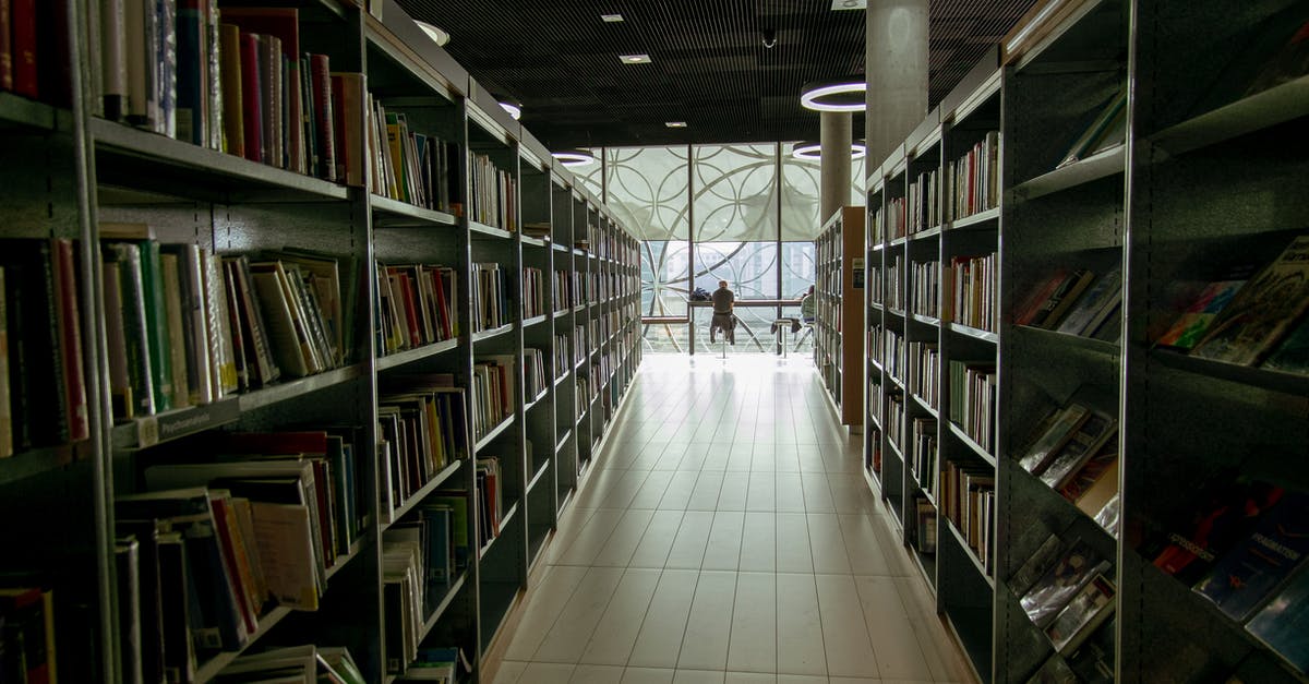 Accompanying my wife (who is student) as a visitor - Interior of library with bookshelves