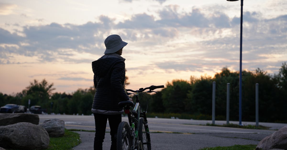 Add a bicycle with Aerolineas Argentinas - Person with Bicycle at Sunset