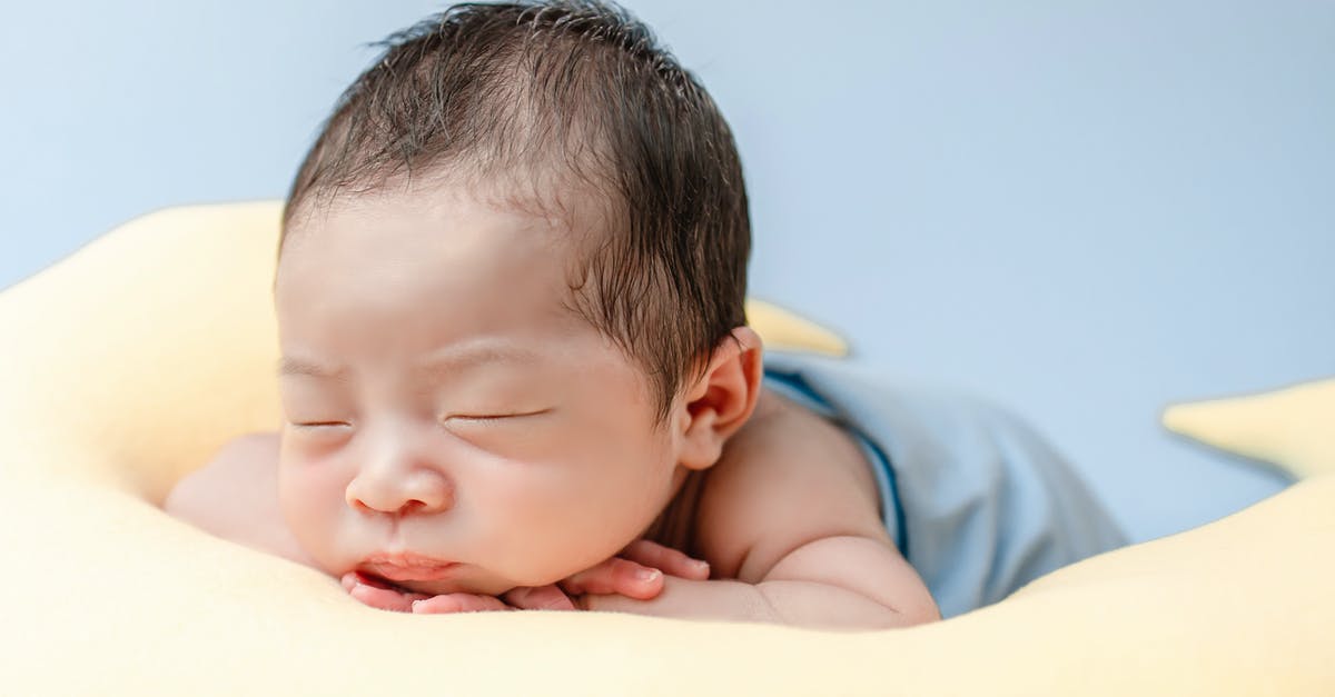 Adding a newborn child to US tourist visa (B1/B2) - Close-up Photo of a Cute Newborn