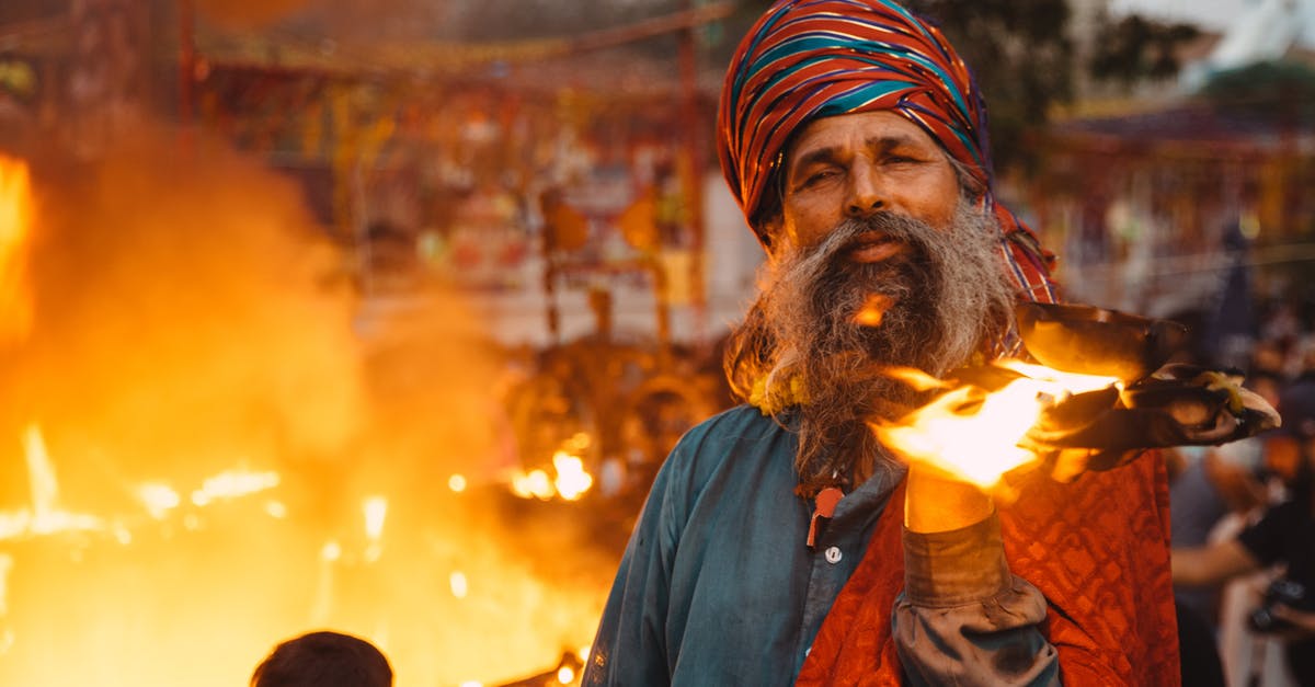 Advices for Burning Man Festival [closed] - Man Holding Burning Book