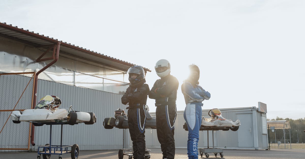 Air travel with a competition sword? - 3 Men in Gray and Black Camouflage Uniform Standing on Gray Pavement