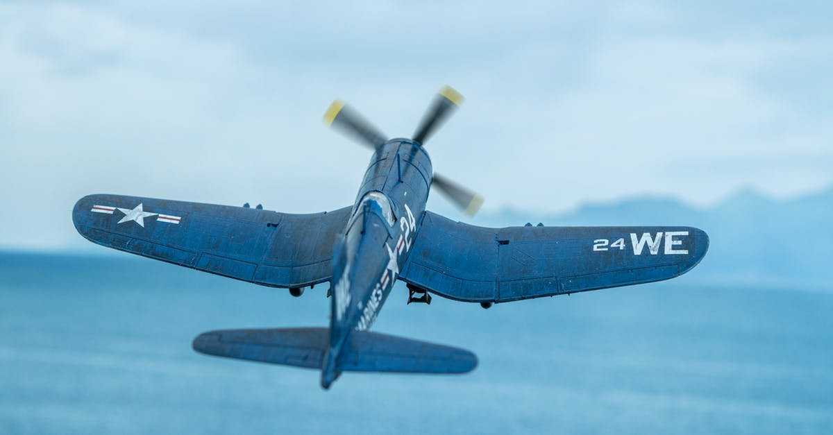 Air Travel within the US - Diorama of a F4U Corsair scale model flying over the sea