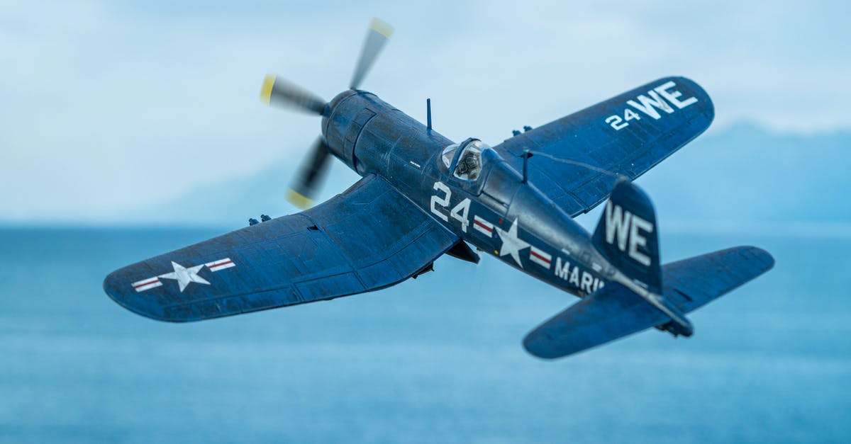 Air Travel within the US - Diorama of a F4U Corsair scale model flying over the sea