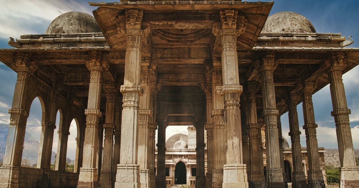 Airline weekly/monthly passes from Gujarat state to Pune, India - Brown Concrete Building  with Columns