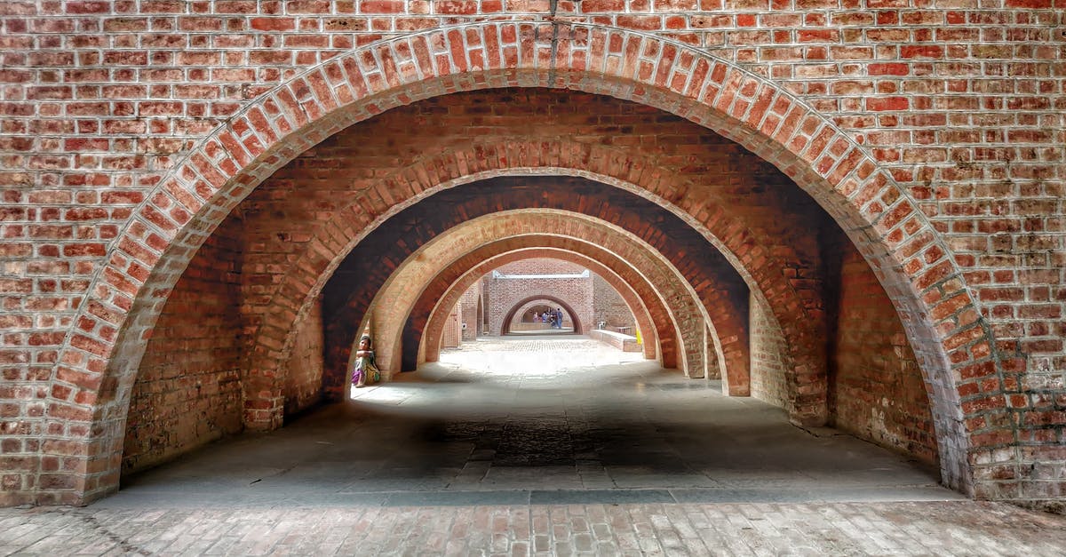 Airline weekly/monthly passes from Gujarat state to Pune, India - Arches Made of Red Bricks in the Indian Institute of Management