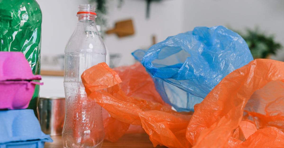 Airplane carry-on allowance and plastic bags - Plastic Bags and Bottles on a Wooden Desk