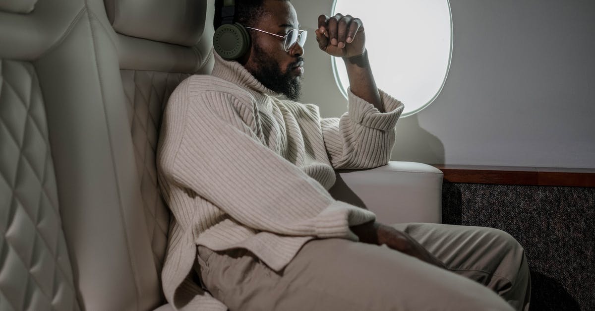 Airplane Seat Recline Measurement... in units of length inches? - Man Sitting Near the Airplane Window