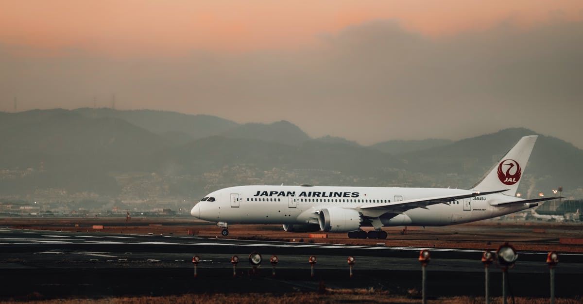 Airport in Japan without Retina Scan - White Passenger Plane on Airport