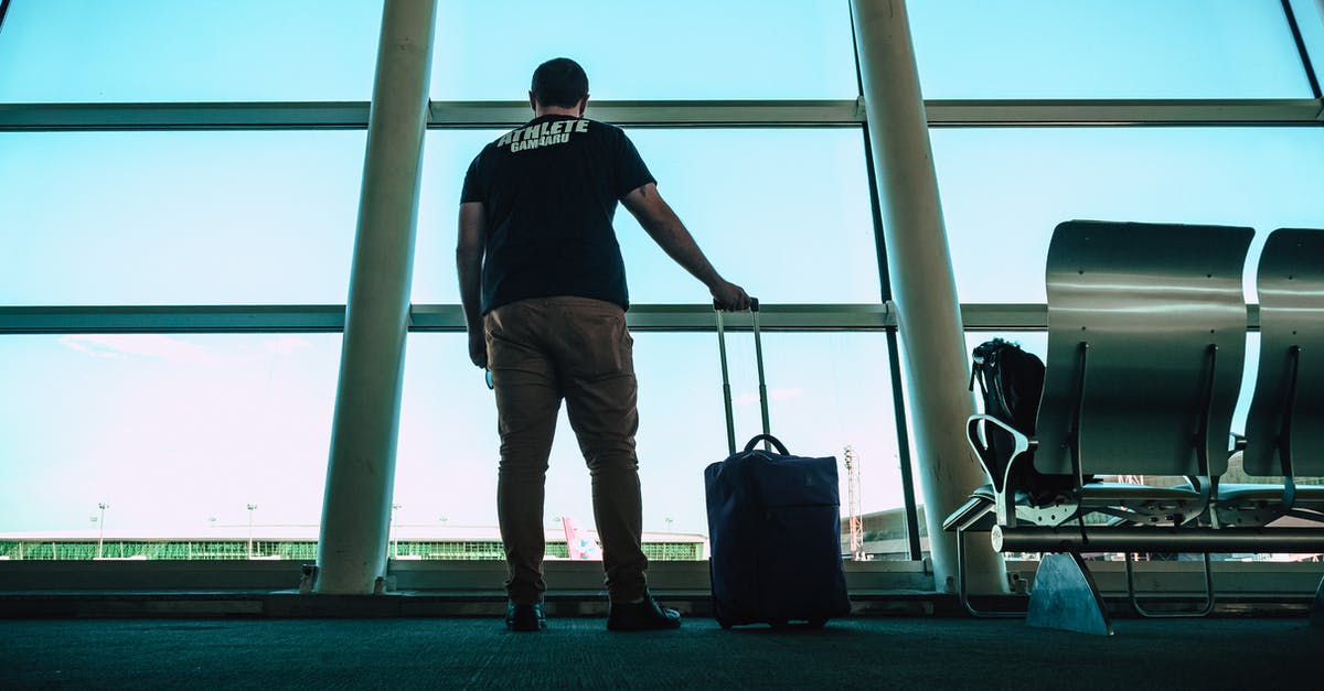 Airport Lounge in OR Tambo International Airport, Johannesburg - Man Holding Luggage Bag