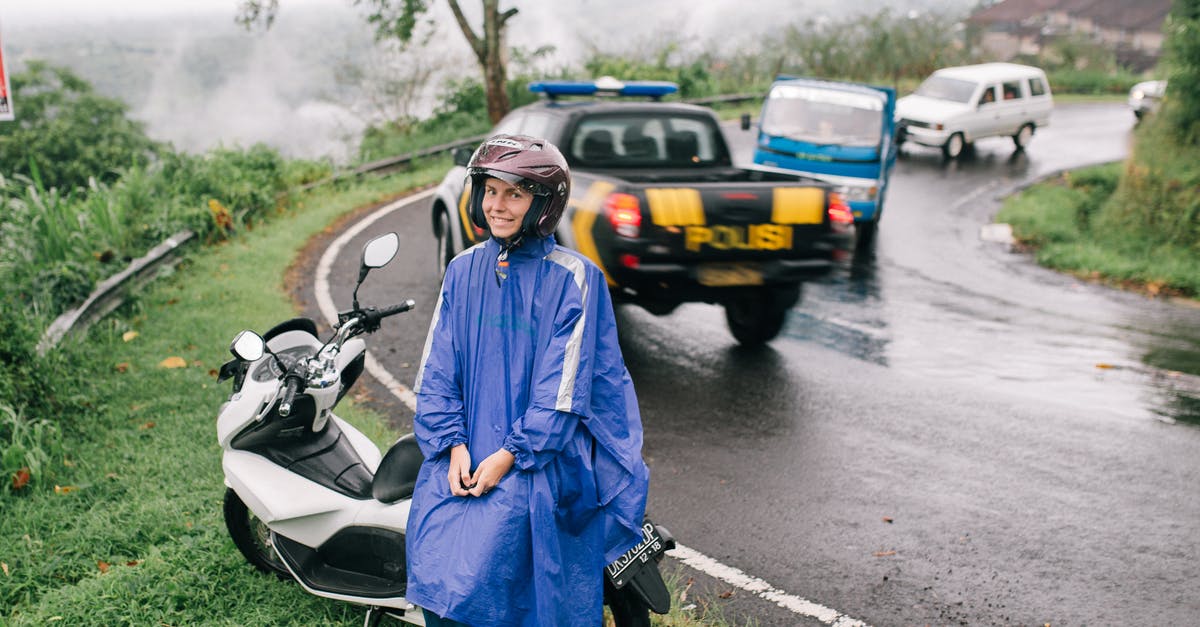 Albania traffic requirements - Woman in Blue Robe Standing on Road