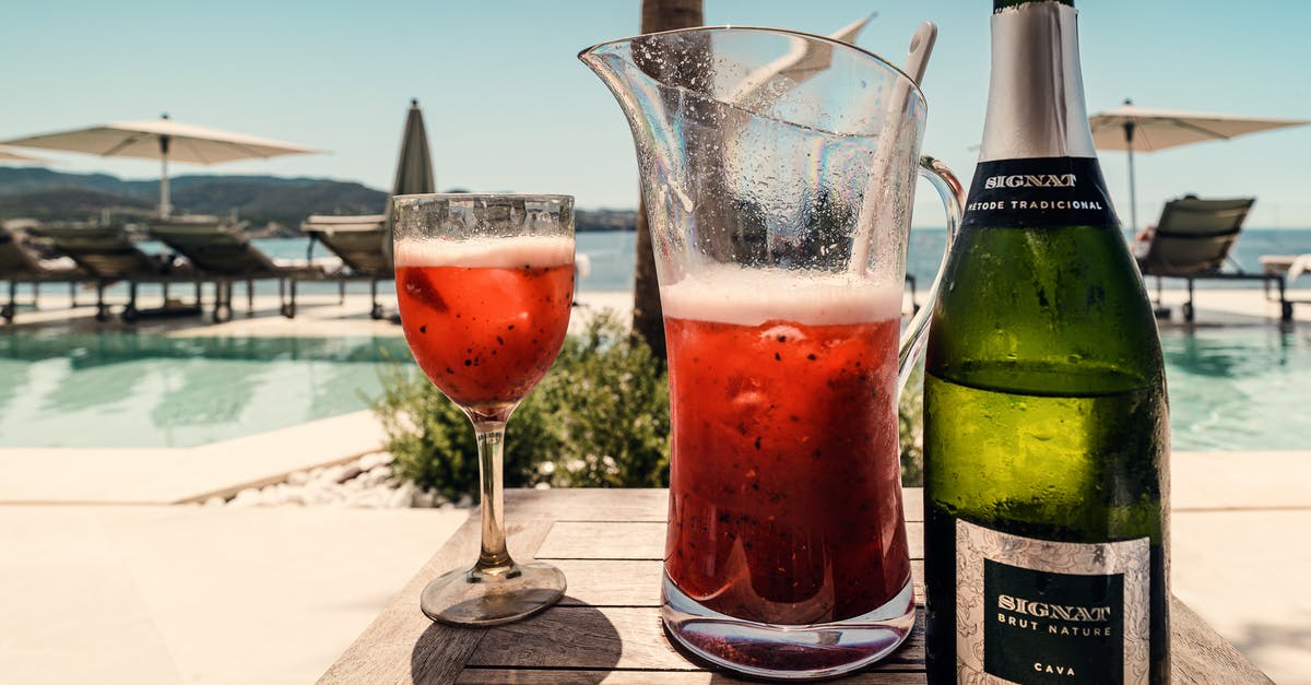 Alcohol-fuel for burner in Spain - Photo Of Wine Bottle On Top Of Wooden Table