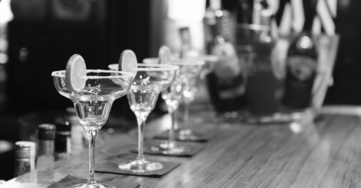 Alcohol-fuel for burner in Spain - Grayscale Photography of Margarita Glass on Table