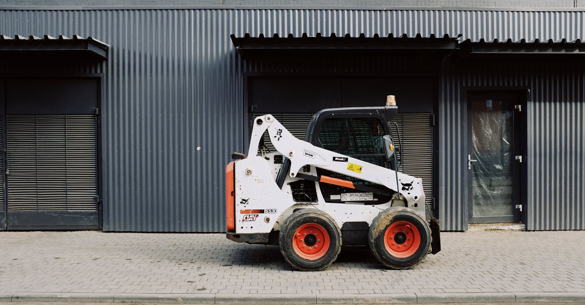 All day vs street parking in Edinburgh and Glasgow - Small truck parked near warehouse on sidewalk on street