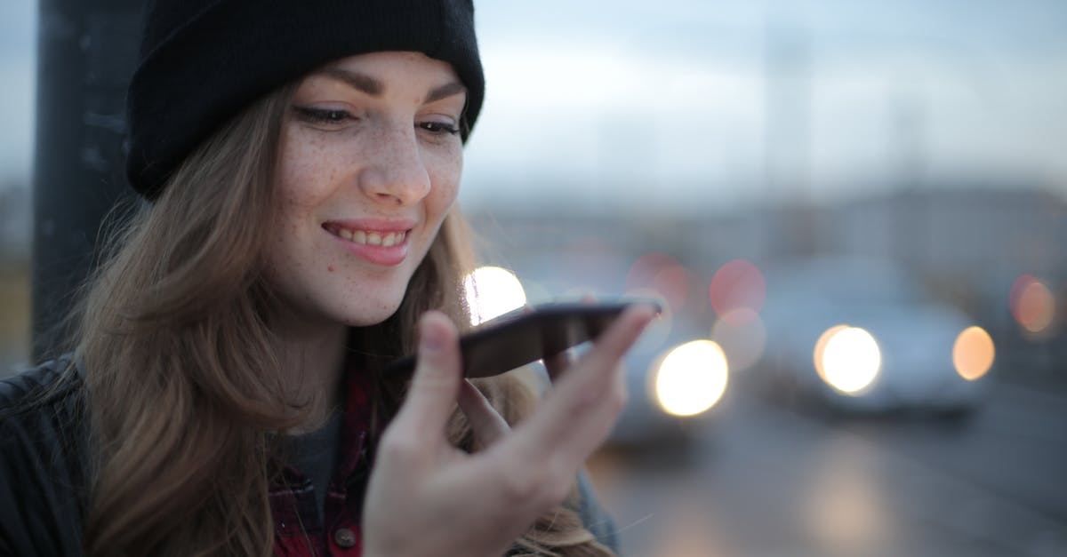 Allergic online resources for traveling - Joyful young woman phoning on street in evening