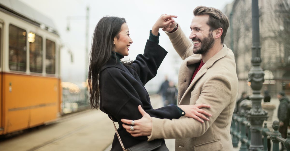 Almaty to Urumqi by connecting train (via Altynkol and Khorgas) - A Happy Couple Dancing On Sidewalk