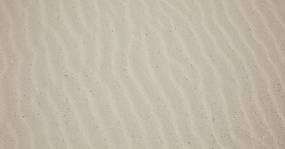 Almeria Spain beach season - Top view of empty dry plain surface of beach covered with sand in daytime