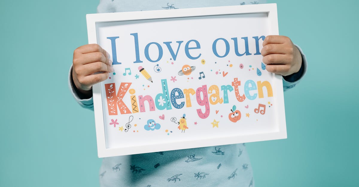 Am I a dependent child for UK visa? - Kid Holding a Frame with a Message