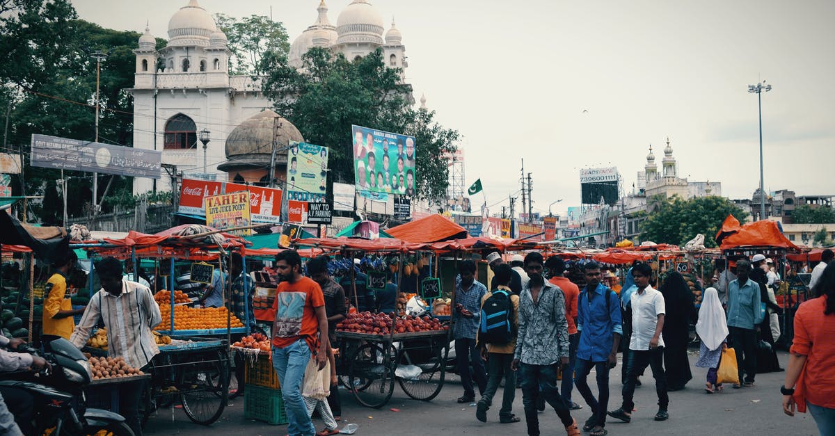 Am I allowed to bring 10 lbs whey protein into India - People Walking on Street