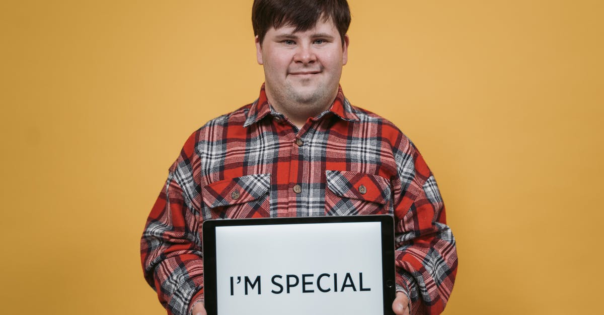 Am I allowed to own a foreign flag? [closed] - Man Holding an Ipad with a Message on a Yellow Background