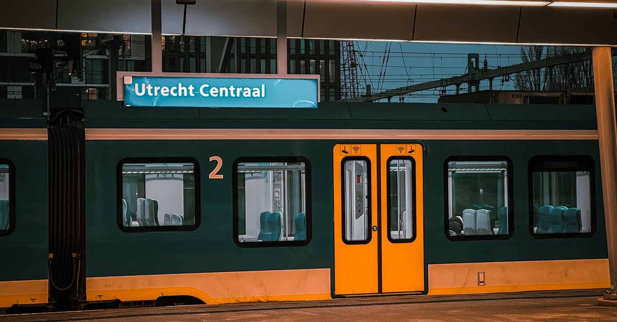 Am I allowed to transport a bycicle on the train in The Netherlands and Belgium? - A Train in a Train Station