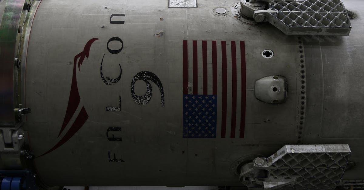 American Airlines in-flight entertainment system language choices - Fragment of modern spacecraft with printed flag of United States of America during assembly in rocket factory