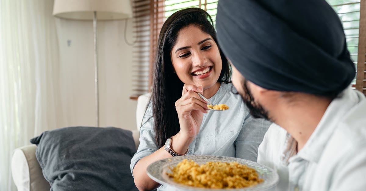 American ID requirements for indian domestic flights - Smiling woman feeding man in turban