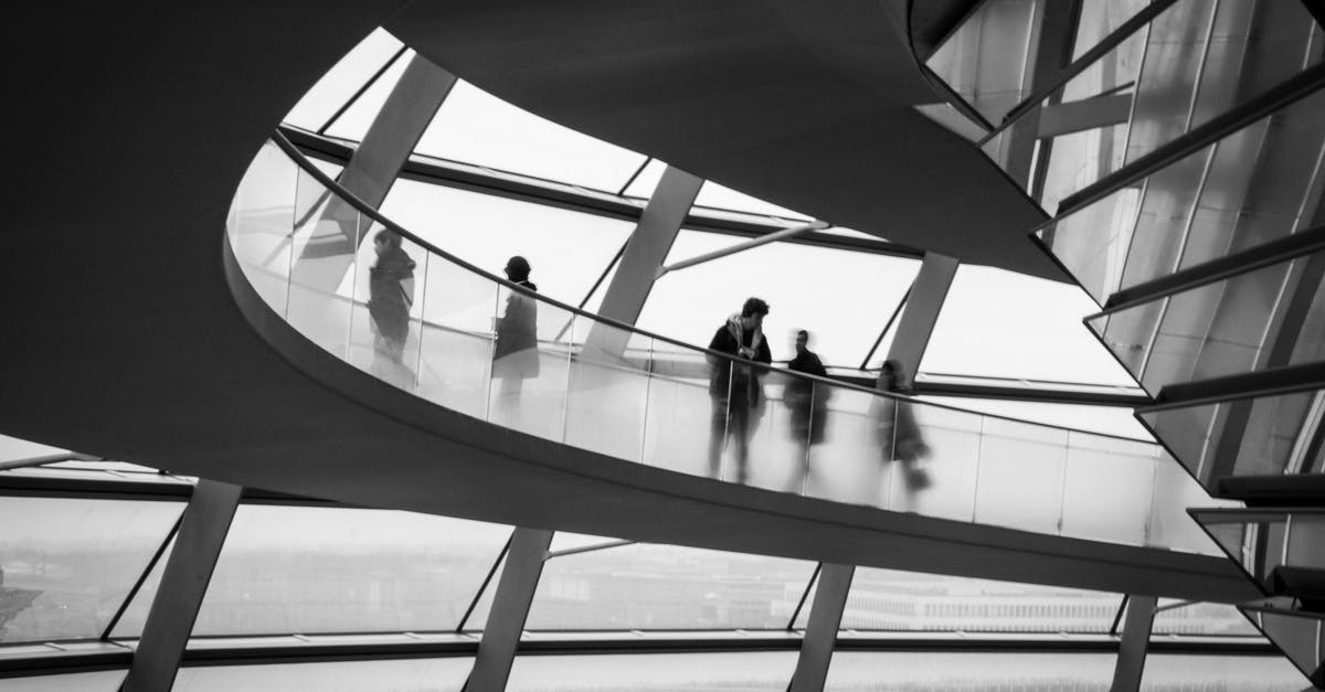 American overstay in Germany - People Going Up on the Escalator in the Reichstag Dome, Berlin, Germany 